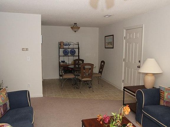 living room looking into kitchen eat-in area
