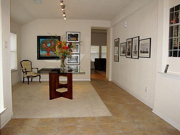 Front door opens to a large party sized formal dining room.