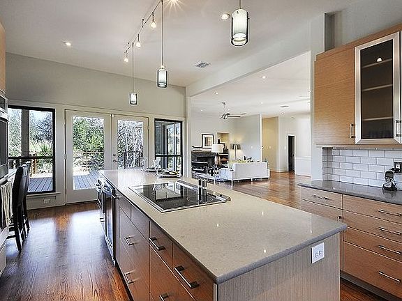 Kitchen and upstairs living open directly to outdoor patio - perfect for enter