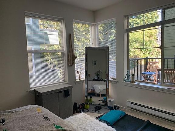 Master bedroom looking out on wrap around deck and alley way.