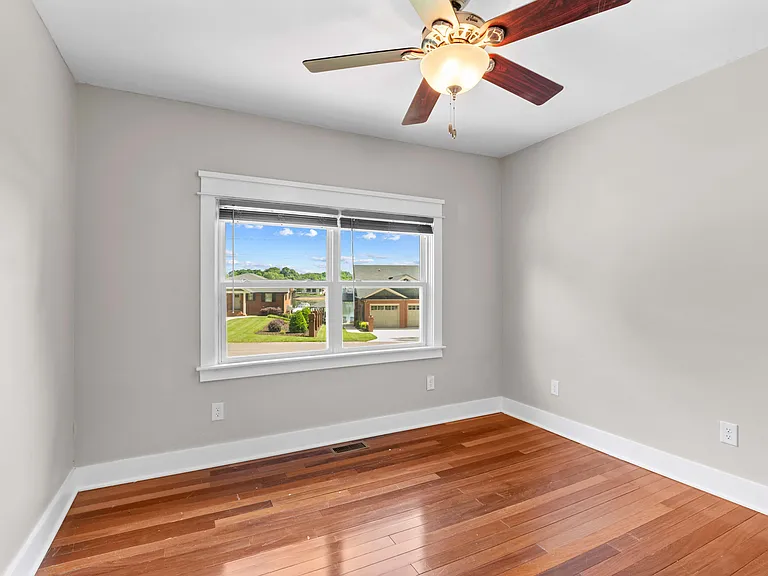 Front bedroom #1 with lake view or could be home office with view!