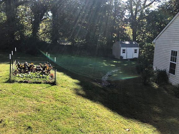 North side. storage unit and vegetable garden.