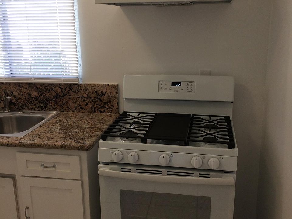 New stove and granite kitchen counter.