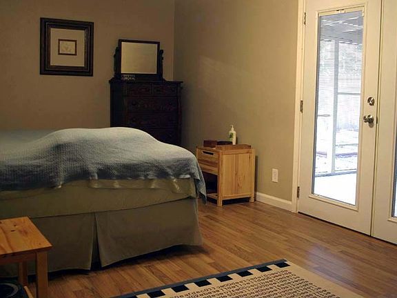 Master bedroom with recent laminate and french doors.
