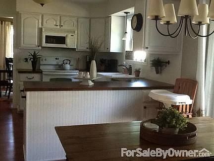 Separate Formal Dining Room
						:
						Large space off of the kitchen with good natural lighting for entertaining