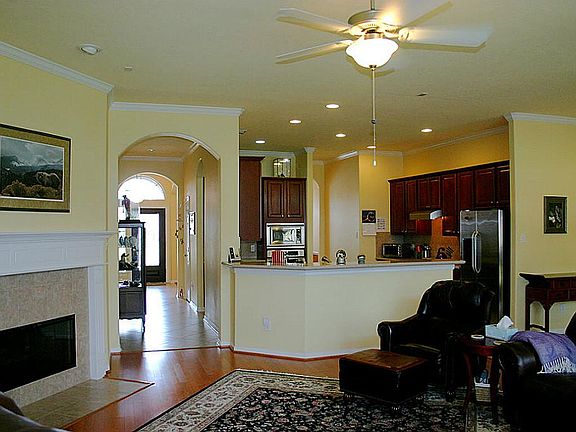 Spacious and comfortable family room featuring hardwood floors.
