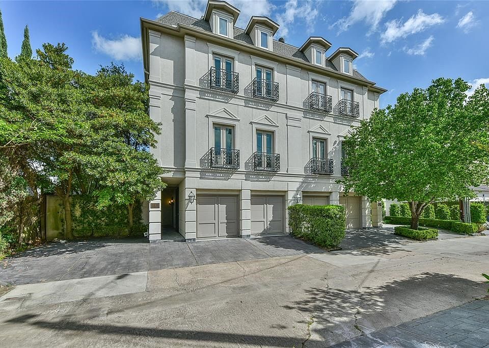 Welcome to 3112 Alabama Court.  This elegant home is located at the end of a quite street surrounded by mature trees and lush landscaping.  Wrought iron Juliet balconies and french doors accent this stucco townhouse.  Additional guest parking is located to the left of the front entry.
