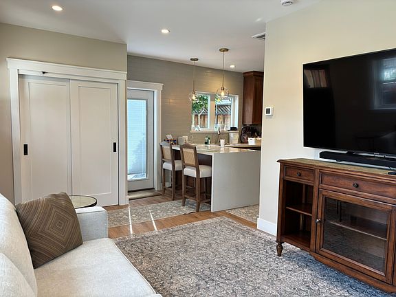 Open Concept living/dining/kitchen space. 

Spacious entry closet/pantry for storage