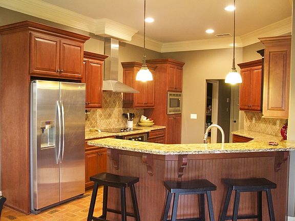 Custom Kitchen
						:
						All stainless appliances, custom cabinets, granite, travertine, brick floors