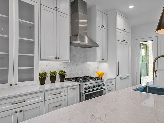 Gas range, quartz countertops and built in refrigerator