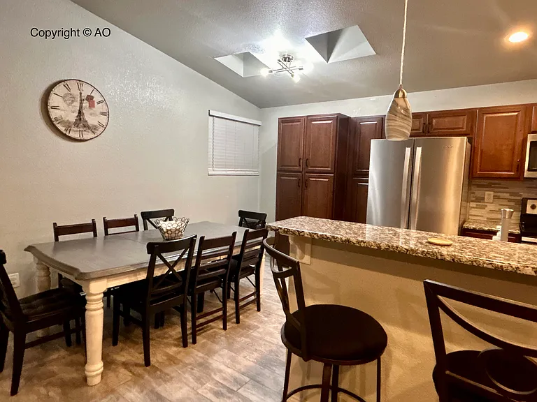 Large kitchen table, lots of pantry space, large refrigerator