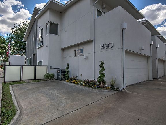 2-car garage and private courtyard and balcony enhance the well-appointed condo.