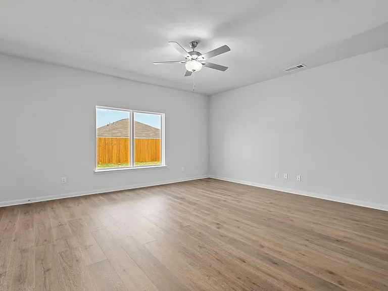 The spacious family room has plenty of space for hosting and everyday life.
