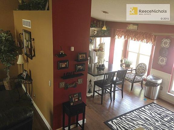 From upper level looking into kitchen bay window.