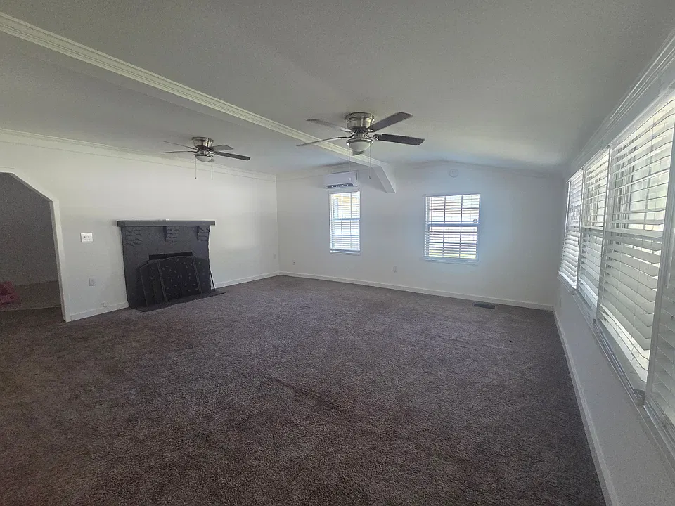 Spacious Living Room with Fireplace, Ceiling Fan & Natural Light. Lakeland, FL