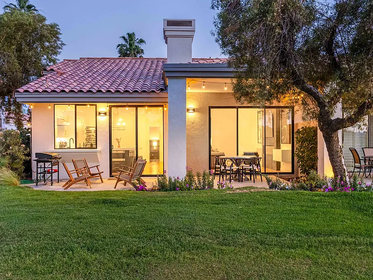 The patio features bistro lights that illuminate the space!
