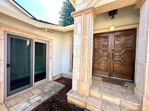 Solid mahogony wood double doors.