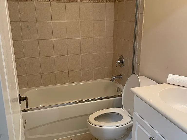 Second bathroom has glass sliding doors