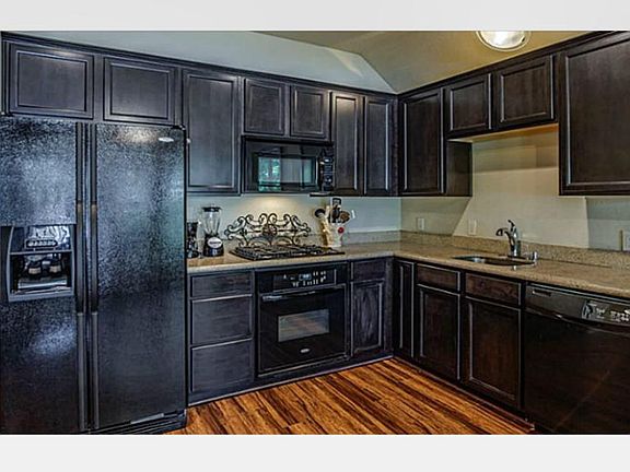 Fridge, Dishwasher, Built in Microwave, Gas Range top, Elect