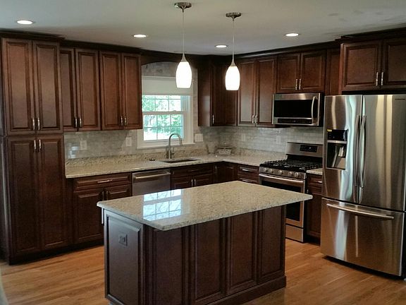 Open concept kitchen, living room, dining area.
