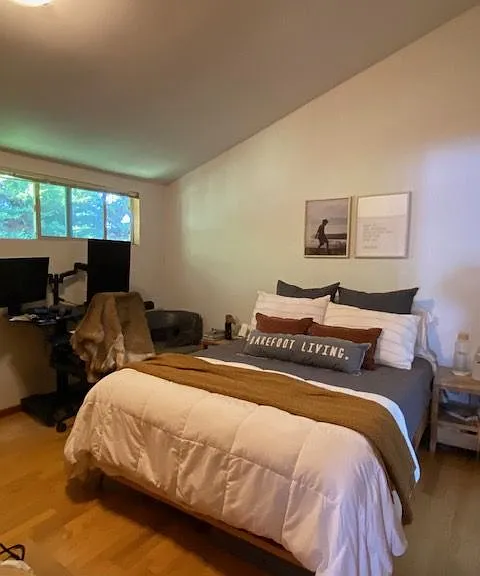 Primary bedroom with soaring ceilings.