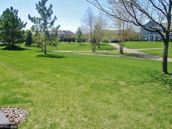 Your view out the back! Home backs to open green space so no one is looking at you from across the yard! Walking paths and only a minute walk to the pool and play areas.