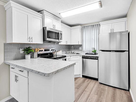 Cherish our stunning, renovated kitchens featuring Carrara-style countertops and wood-style flooring.