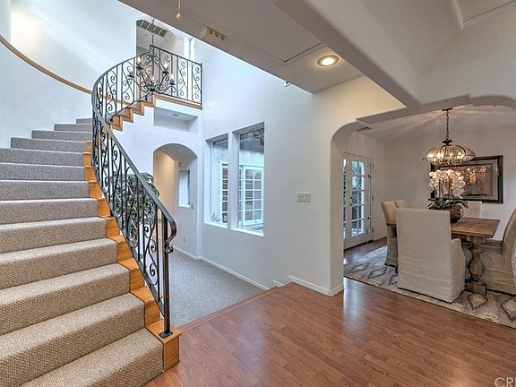 Spiral staircase leads to two upstairs bedrooms an