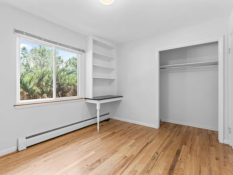 The second bedroom features lots of natural light and spacious closet.