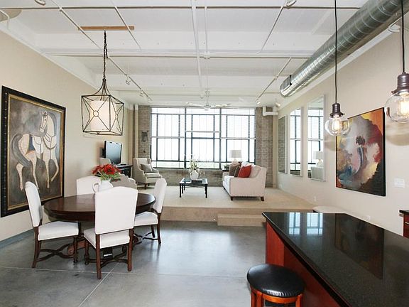 View of living room, dining room, kitchen