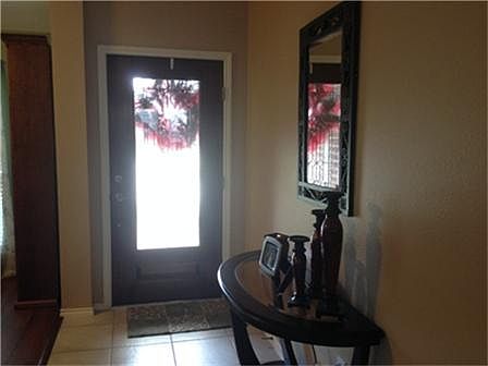 TILED ENTRY OPEN TO DINING ROOM