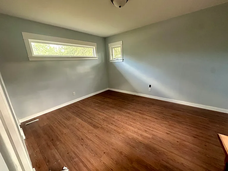 South bedroom with high, private windows, new closet & half bath