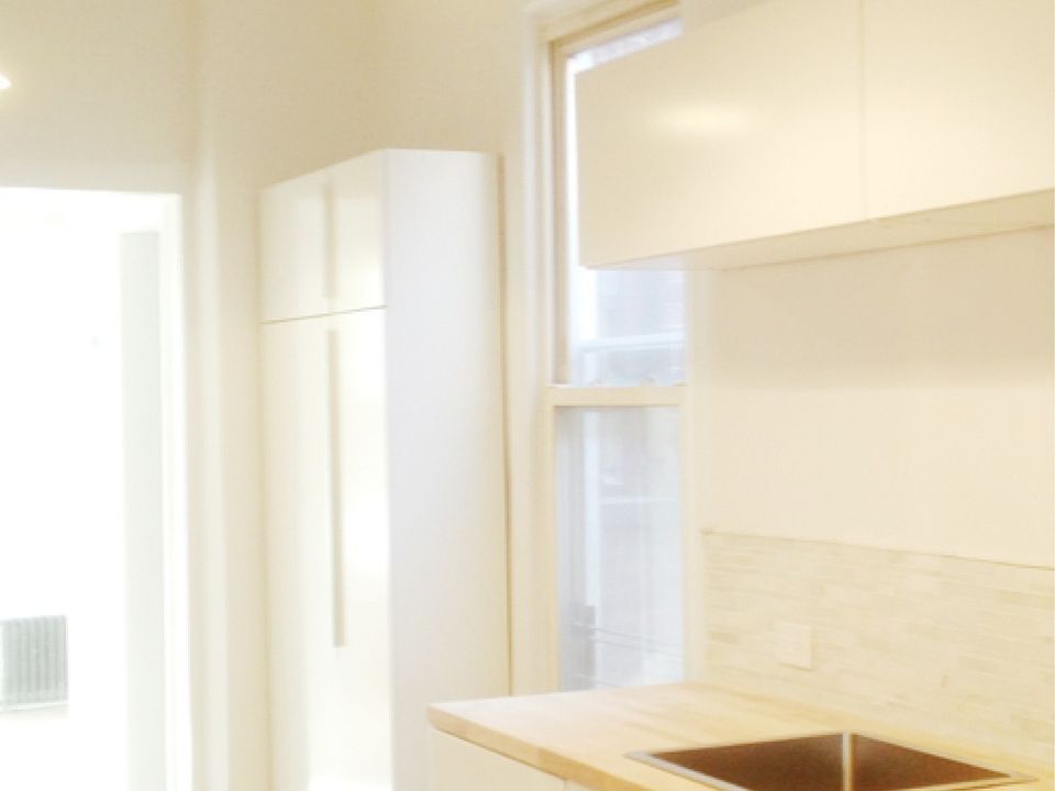 Kitchen and sun filled bedroom