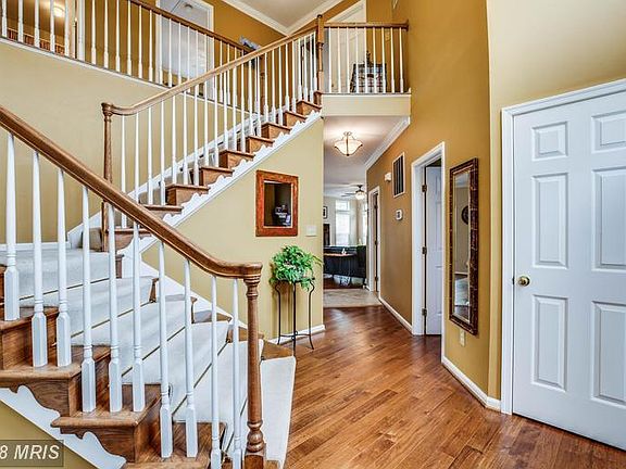 Curved stairs and hardwoods throughout main level