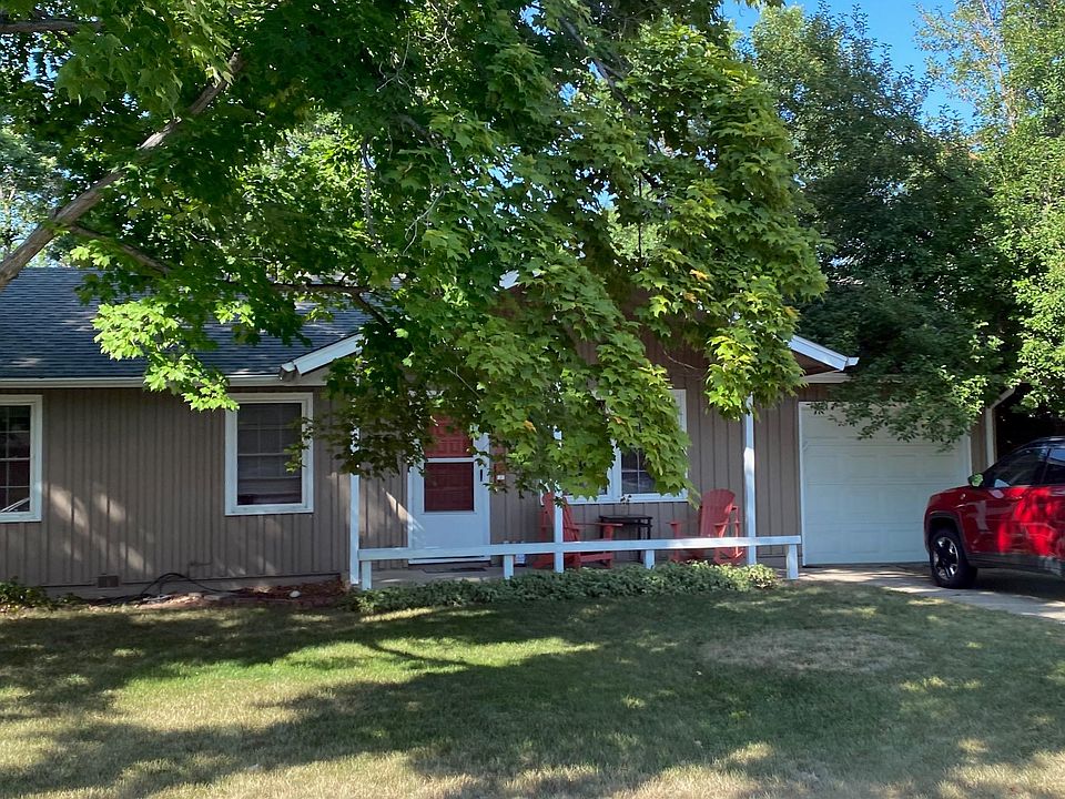 Front of house with shady trees