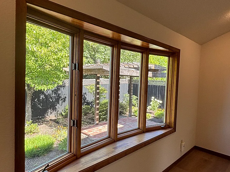 Living room view of backyard patio and garden