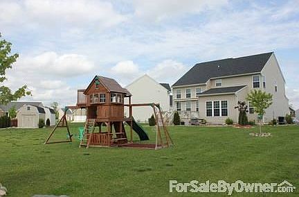 Spacious Back yard with Child's Play Set