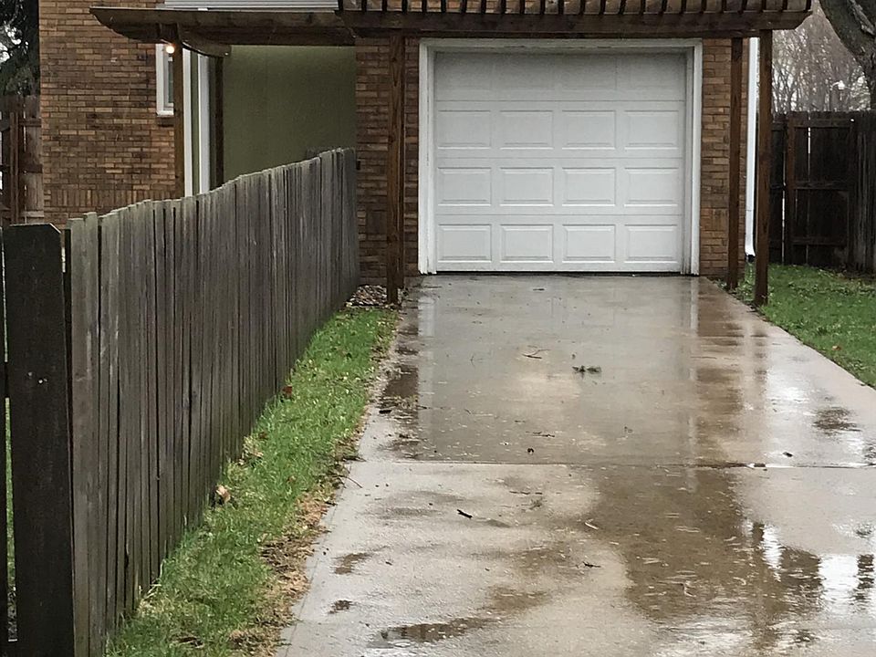 Back access and garage with large fenced in yard 
