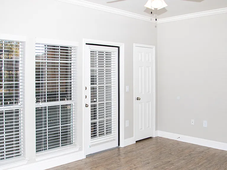 Living area with French doors leading to private patio or balcony