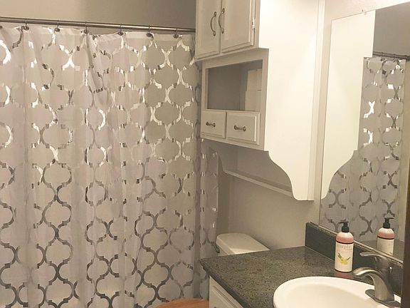 Guest bathroom with granite countertops.
