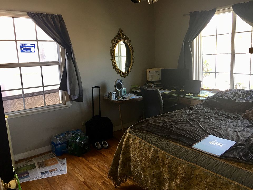Room has a queen bed, desk and a small
refrigerator.