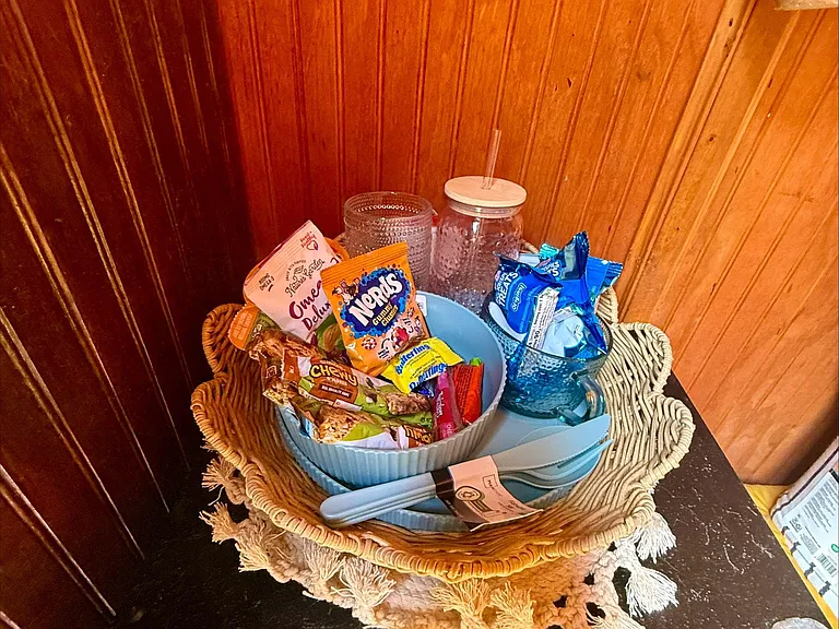 Convenient countertop nook that can be used for snack storage or a small coffee/tea station with easy access.