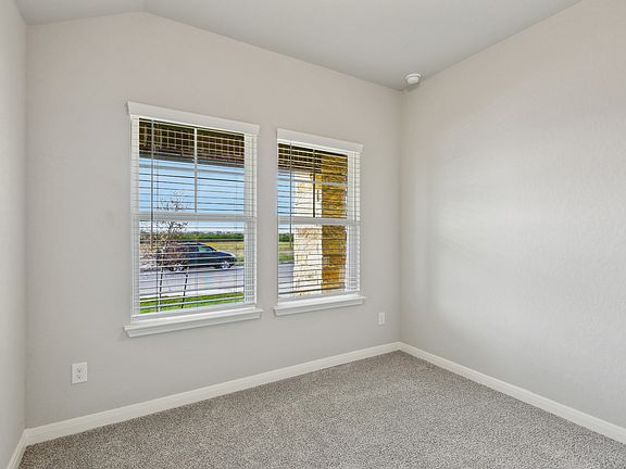 Guest bedroom in the Callaghan floorplan at a Meritage Homes community.