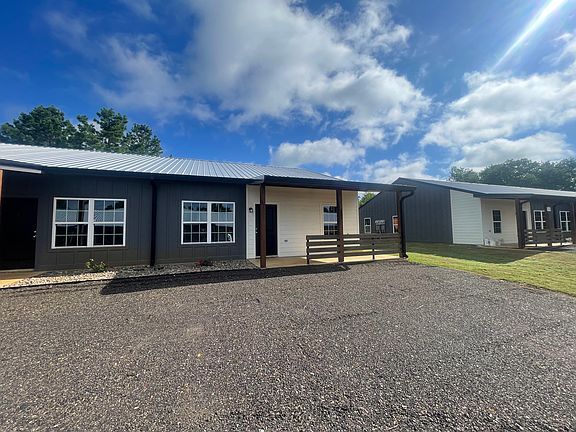This beautiful 4-plex offers the perfect mix of peaceful country living and modern comfort. Surrounded by open space and fresh air, each unit features stylish finishes, updated appliances, and cozy, homey touches _ all just a short drive from town.