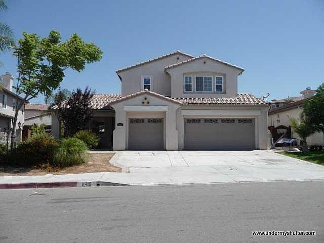 Front view - 3 spaces on driveway, room for 3 cars and storage in garage