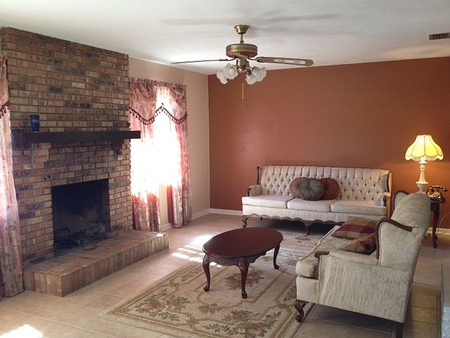 living room has fireplace