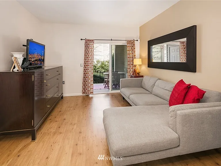 Living room with view to the patio and grass. Virtual staging.