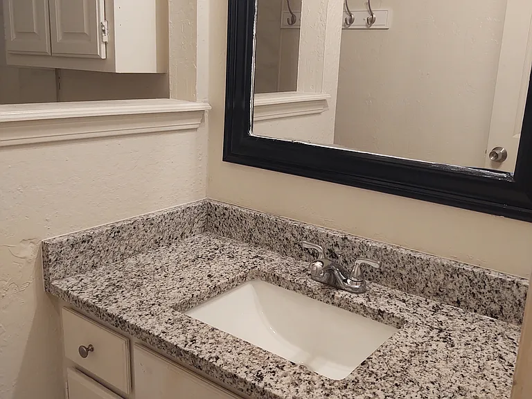 Hallway Bathroom with granite countertop