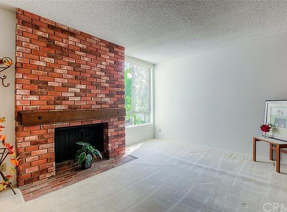 The handsome fireplace is the focal point of this comfortable, spacious den, perfect for hosting family members, friends or an occasional overnight guest.