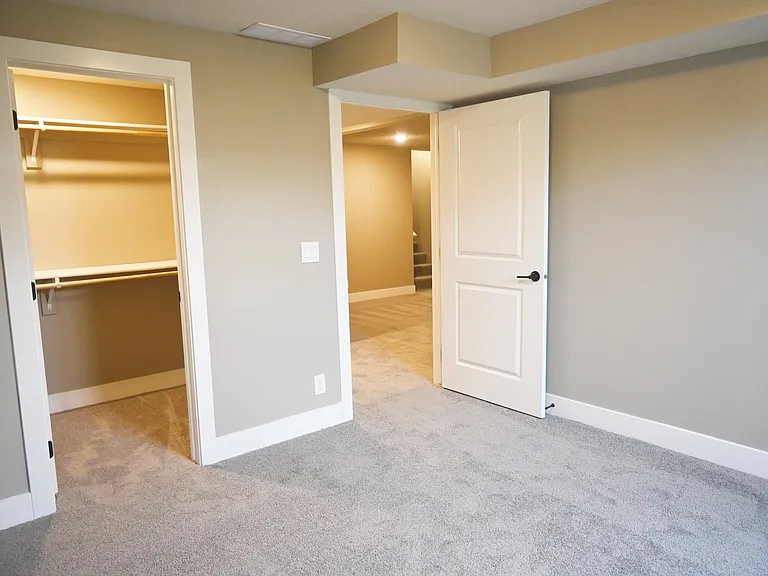 Basement bedroom with large closet.